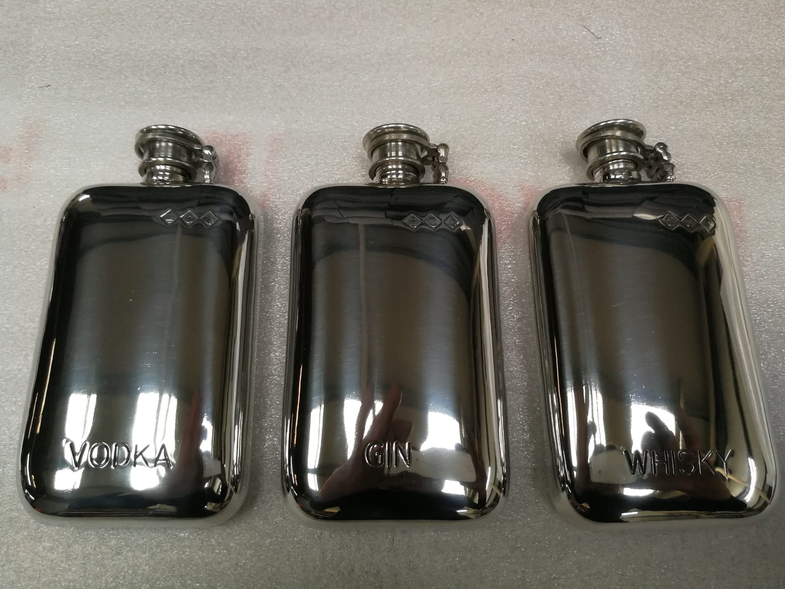 F118 6oz Stamped flask with spirits name embossed